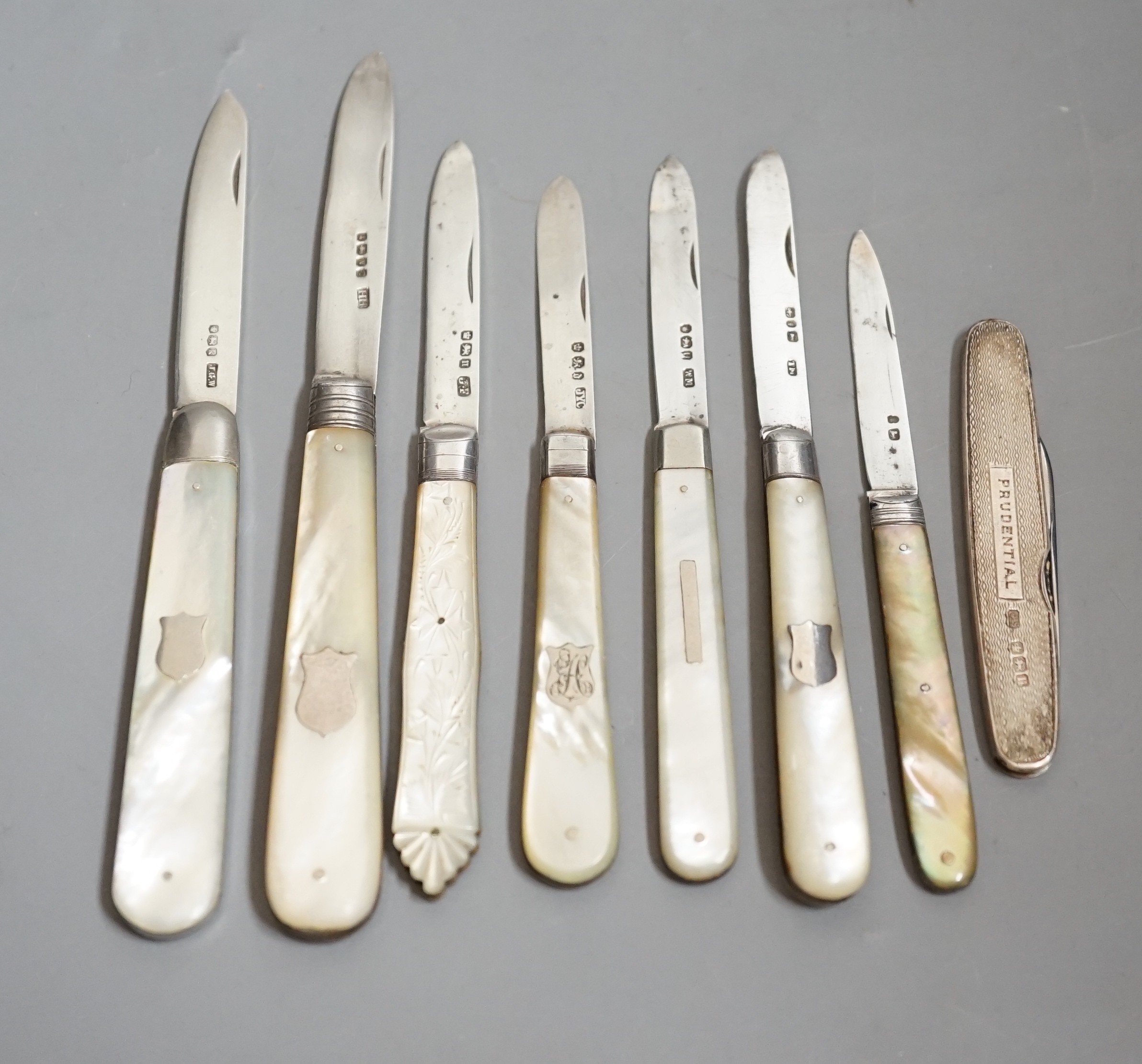 A collection of seven assorted mainly 20th century mother of pearl handled silver fruit knives and a silver cased pen knife.